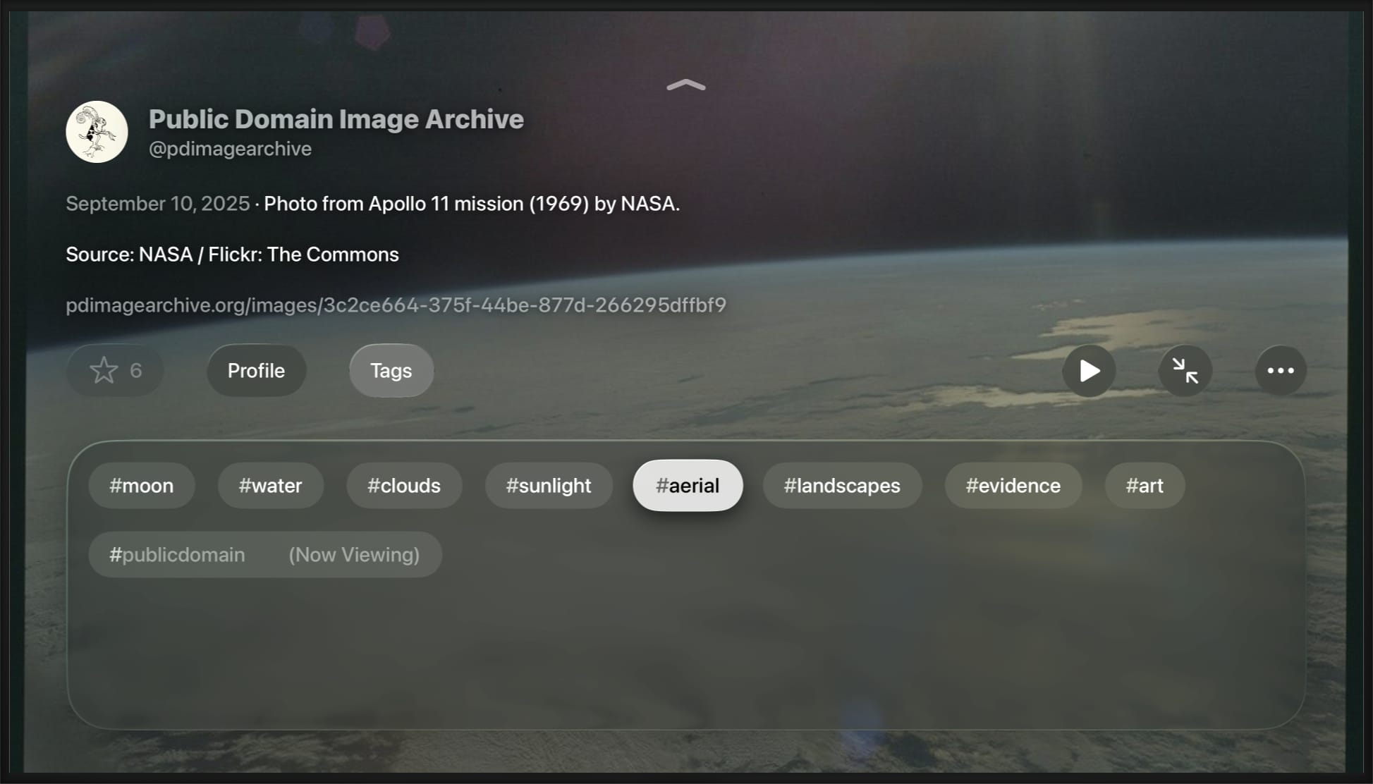 TV screen with a photo of the earth, credited to Public Domain Image Archive, @pdimagearchive. Below that is a translucent panel of buttons to open more photos posted using each hashtag attached to the original photo.